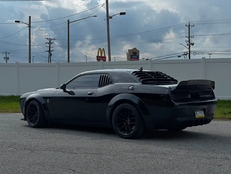 Black Dodge Hellcat with a rear spoiler, wicker bill and rear diffuser by MarxModified